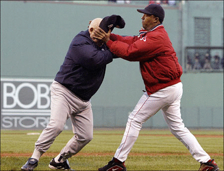 Boston Red Sox pitcher Pedro Martinez throws New York Yankees bench coach Don Zimmer to the ground during an altercation in the fourth inning of Game 3 of the American League Championship Series.